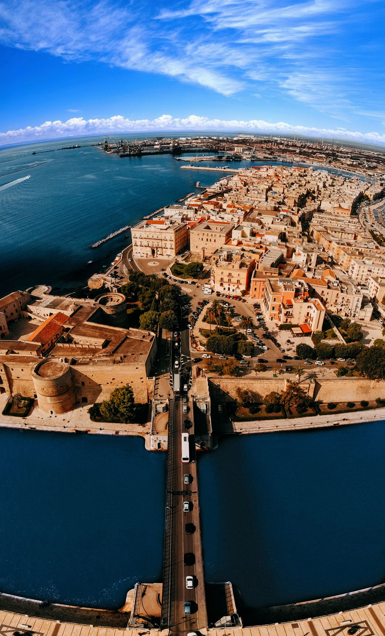 Aerial view of historic Taranto old town peninsula and bridges over the Mar Piccolo, Puglia, Italy
