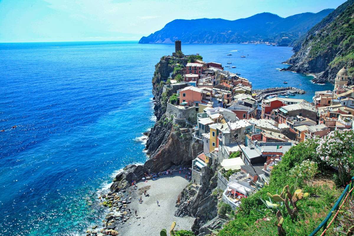Vernazza village stacked on clifftops above the deep blue Ligurian Sea, Cinque Terre, Italy