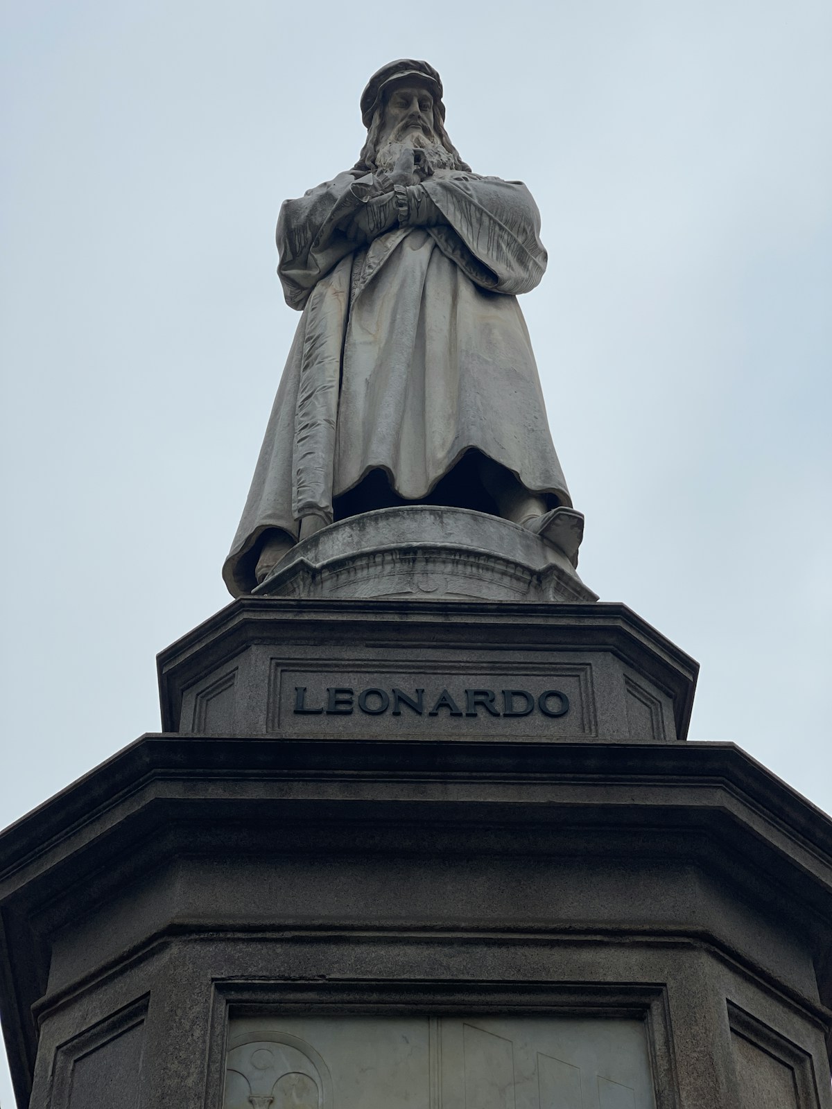 Statue of Leonardo da Vinci on its pedestal in Piazza della Scala, Milan