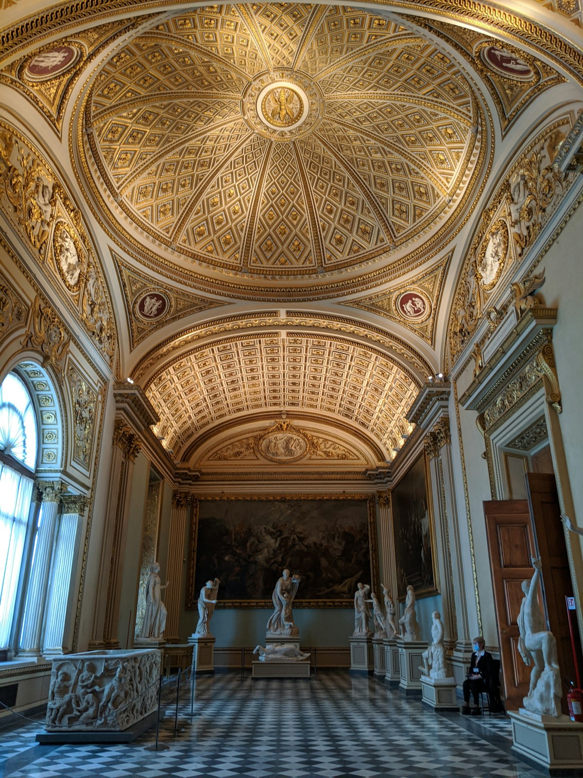 Ornate gallery room with sculptures and gilded ceiling, Uffizi, Florence