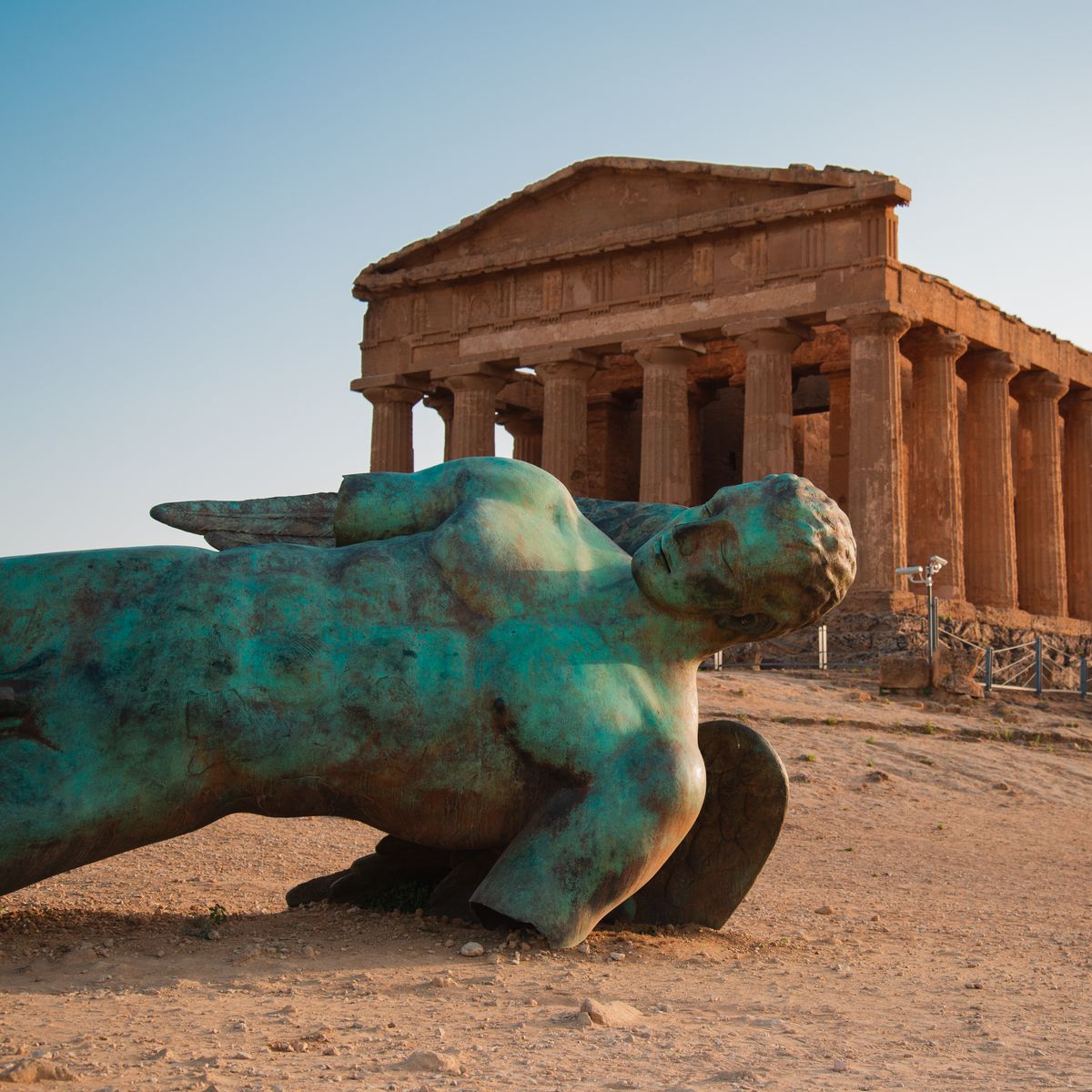 The Temple of Concordia rising above almond blossom at sunset in the Valley of the Temples, Agrigento, Sicily