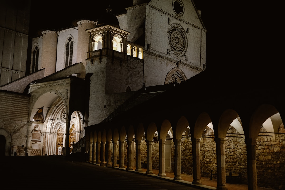Basilica of San Francesco d'Assisi illuminated at night, Umbria, Italy