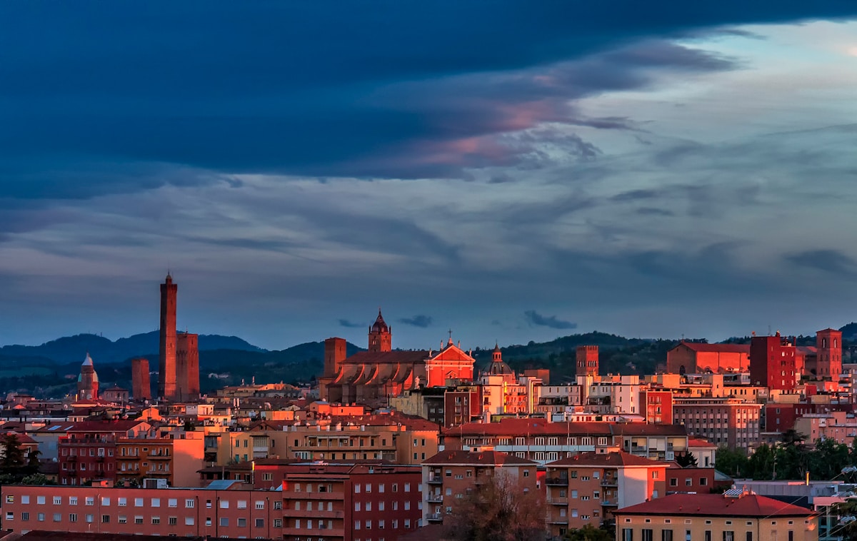 Brown and white buildings under blue sky, Bologna old town, Emilia-Romagna, Italy