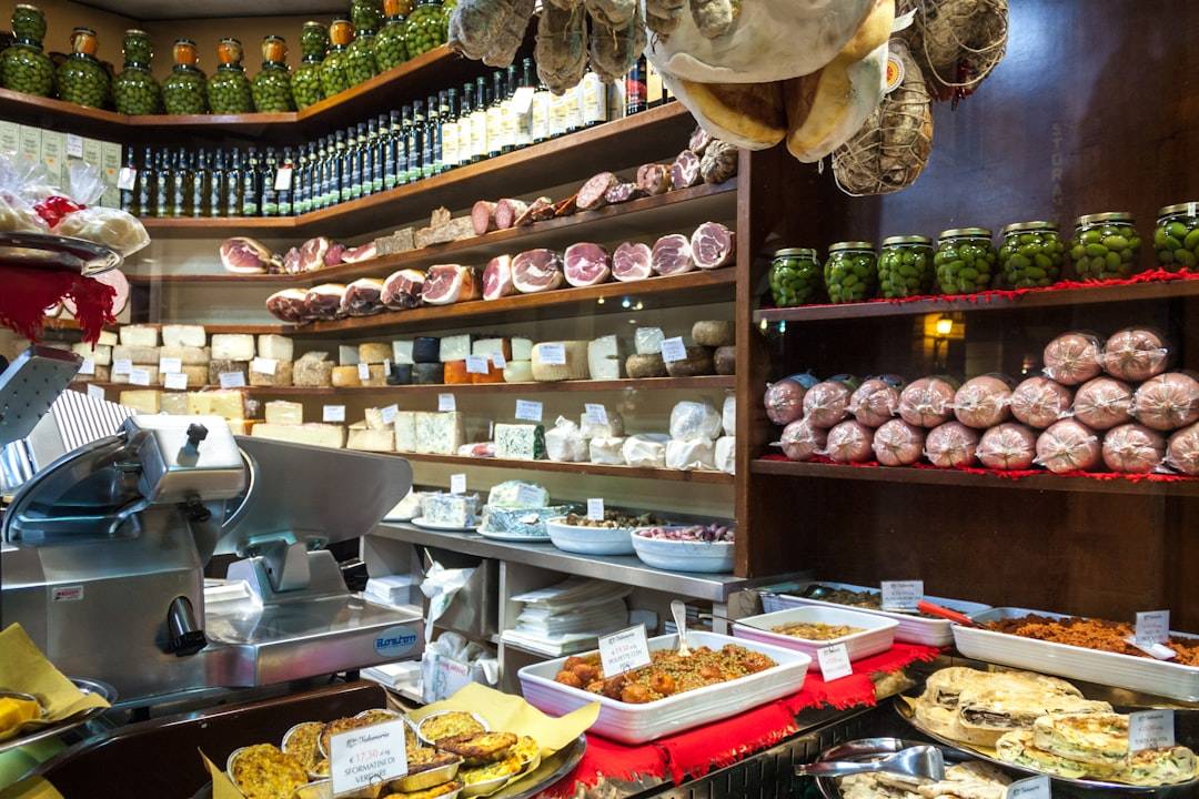 Bologna delicatessen with shelves of cheeses, cured meats, and preserved foods