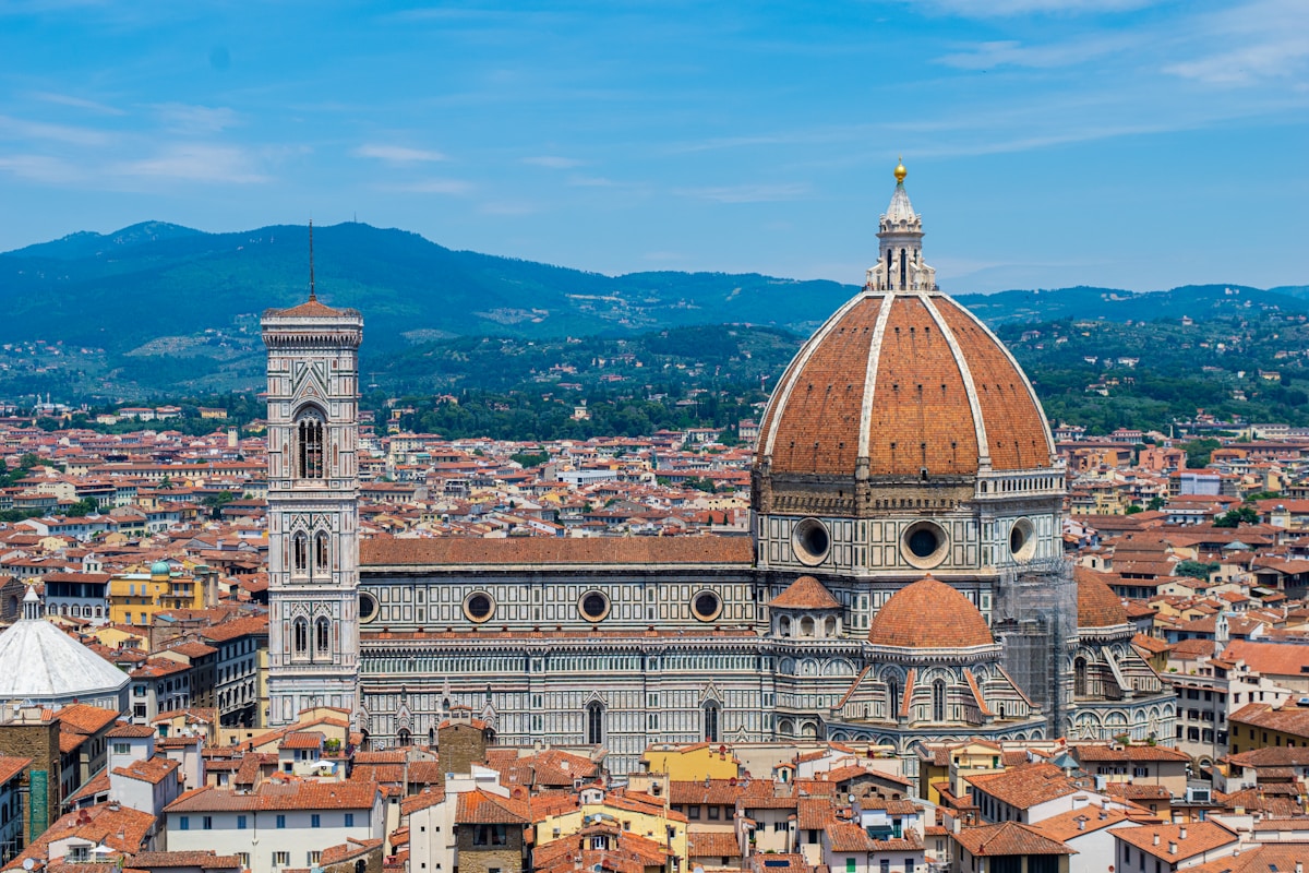 Florence cityscape with the Duomo cathedral and mountains in the background, Tuscany, Italy