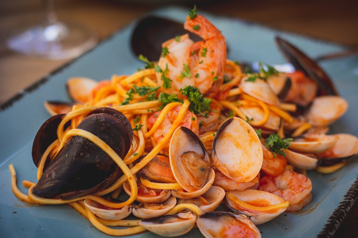 Plate of spaghetti with clams, mussels, and shrimp, classic Italian seafood pasta, Campania, Italy