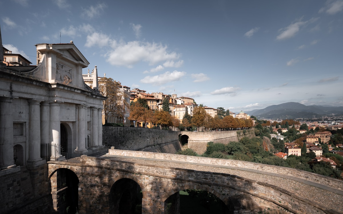 Porta Sant'Alessandro gate and Venetian walls overlooking the Bergamo Alta skyline