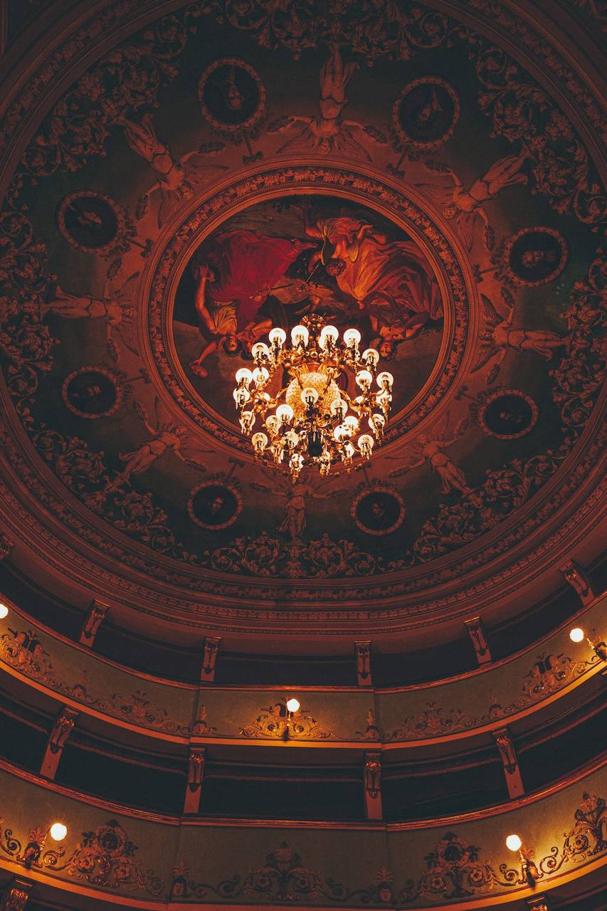 Ornate chandelier and painted ceiling of the Serpente Aureo Theatre in Offida, Province of Ascoli Piceno, Le Marche, Italy