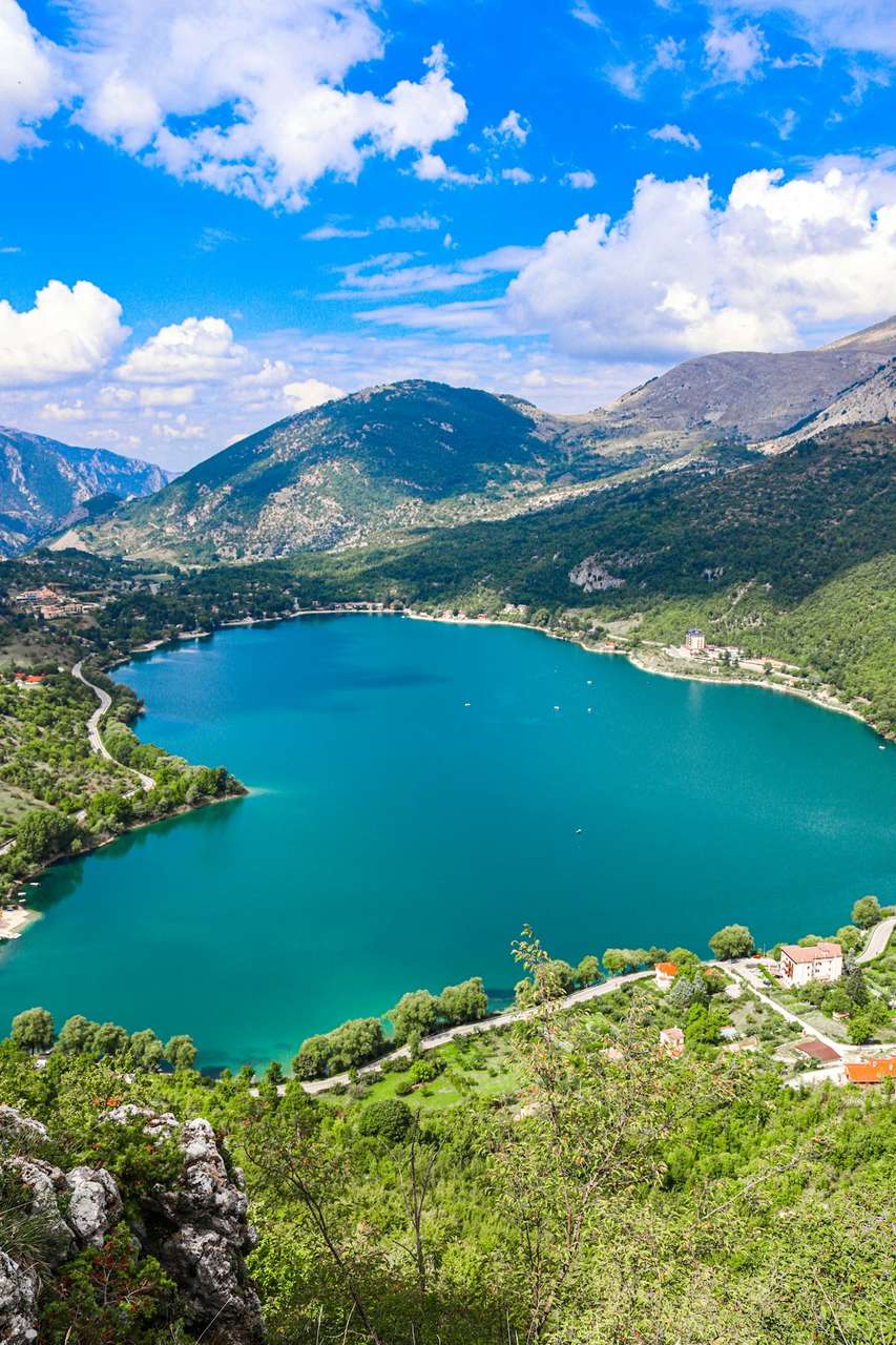 Turquoise heart-shaped Lake Scanno surrounded by Apennine mountains, Abruzzo, Italy