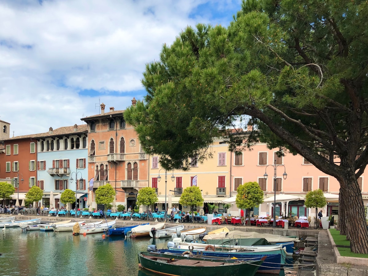 Boats in harbour next to buildings, Desenzano del Garda, Lombardy, Italy