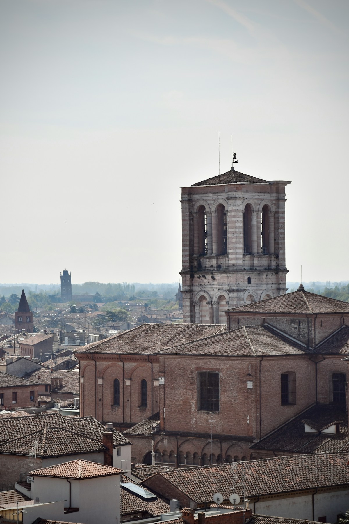 View of Ferrara city with clock tower, Emilia-Romagna, Italy