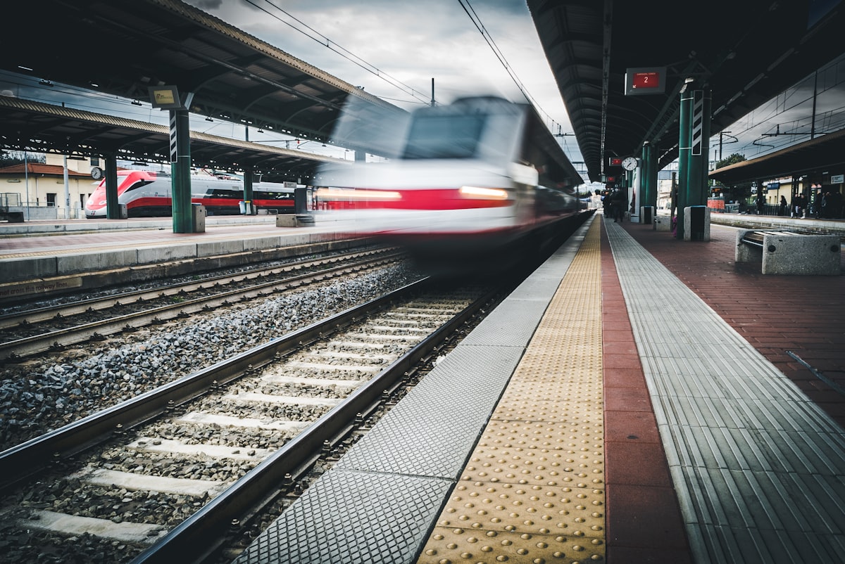 High-speed train in motion at Florence Santa Maria Novella station, Italy