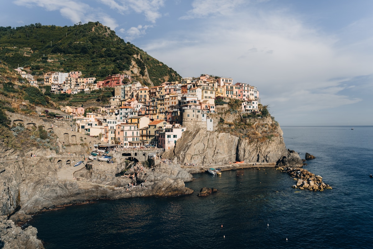 Small Cinque Terre village on cliff above ocean, near Genoa, Liguria, Italy