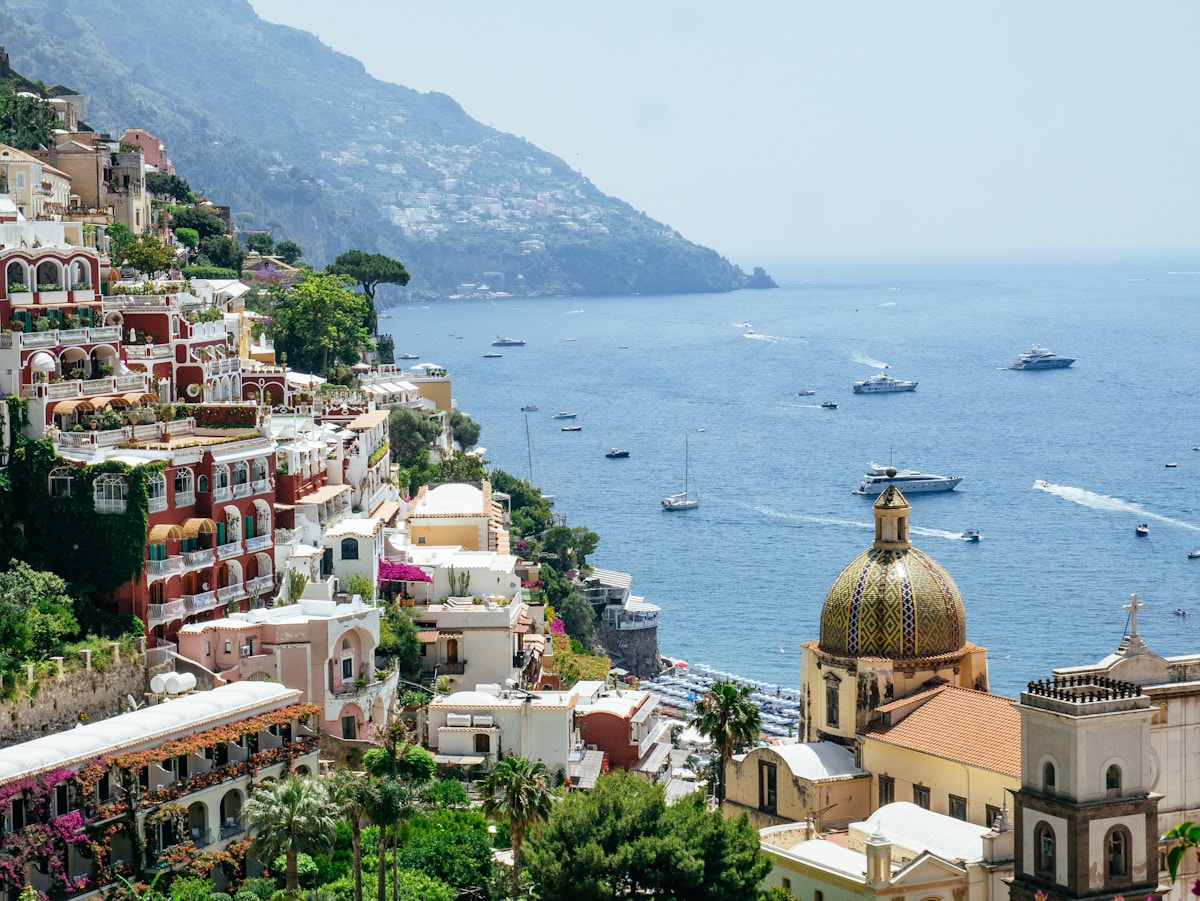 Positano village cascading down cliffs above the sea, Amalfi Coast hotels, Italy