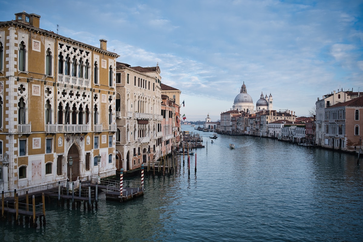 Grand canal in Venice with historic buildings and dome, Italy