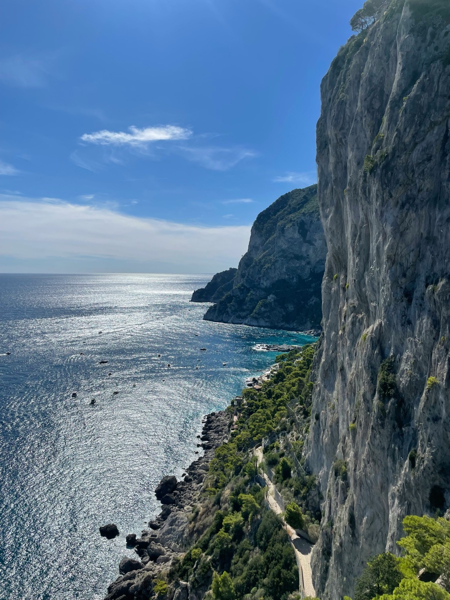 Dramatic limestone cliffs dropping to the turquoise sea on the Via Krupp path, Capri, Italy