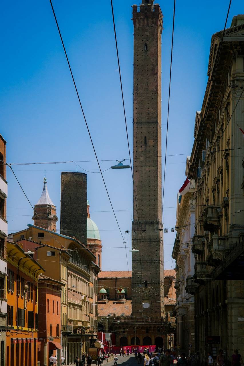 Historic towers of Bologna standing tall under a clear sky, Emilia-Romagna, Italy