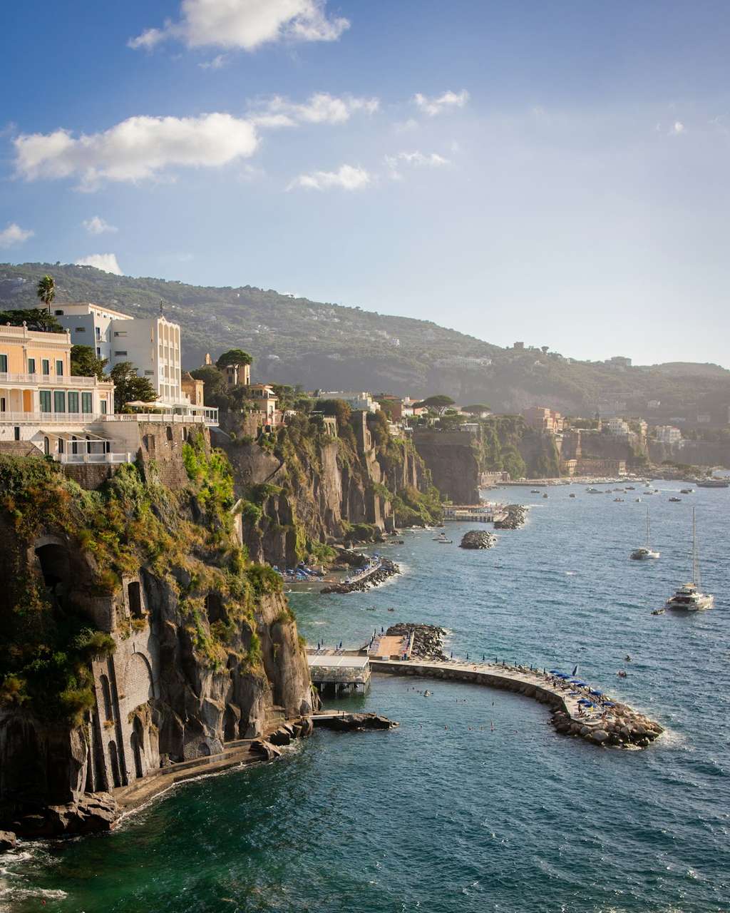 Cliffs and buildings line the coastal waters of Sorrento, Campania, Italy