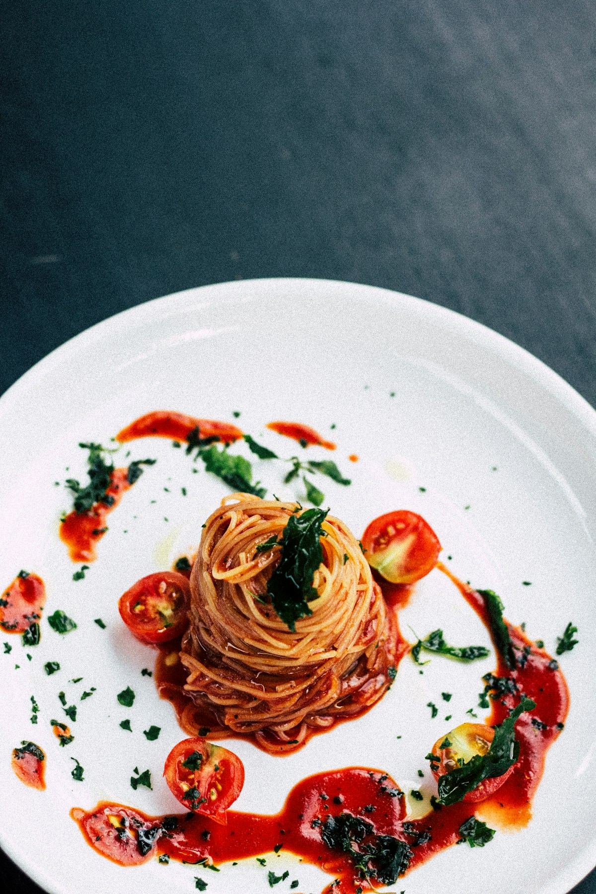 Pasta in tomato sauce on a plate, Italian cuisine