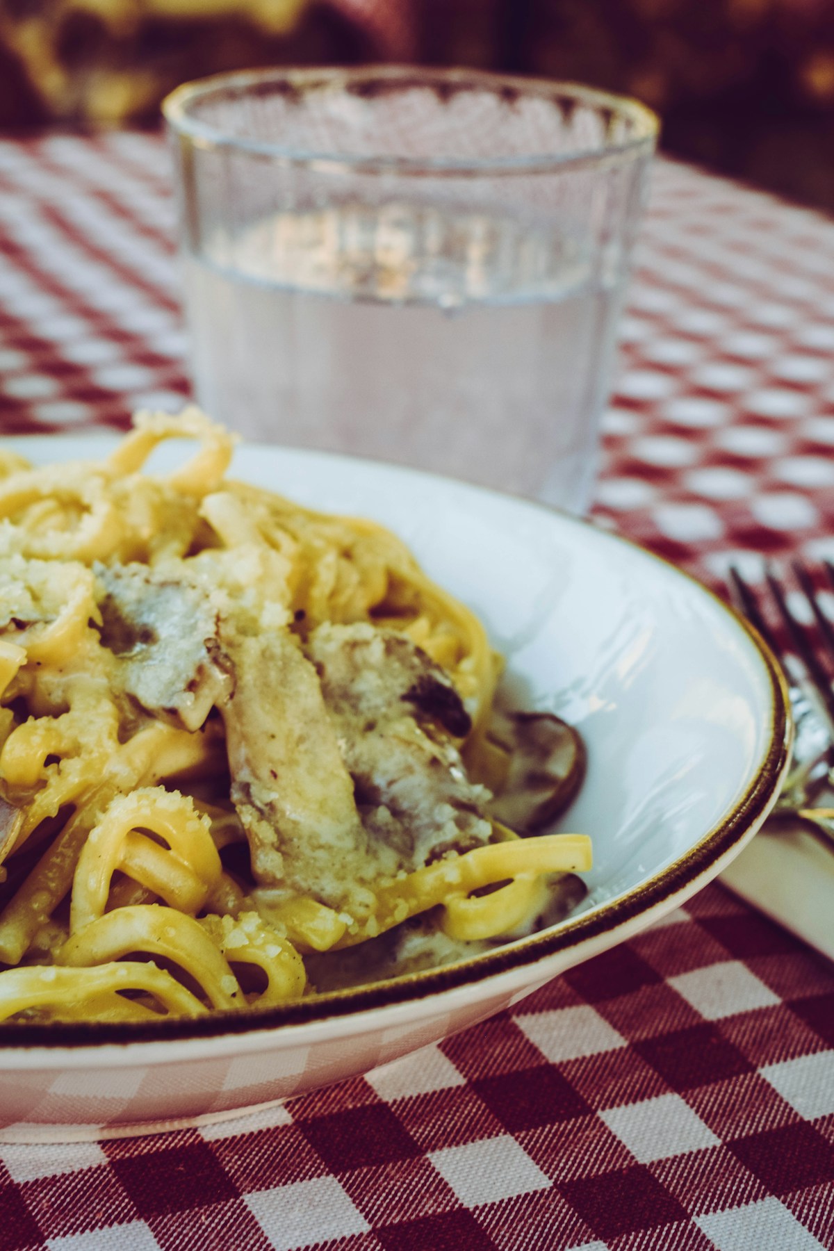 Pasta dish on white ceramic plate, Italian cuisine