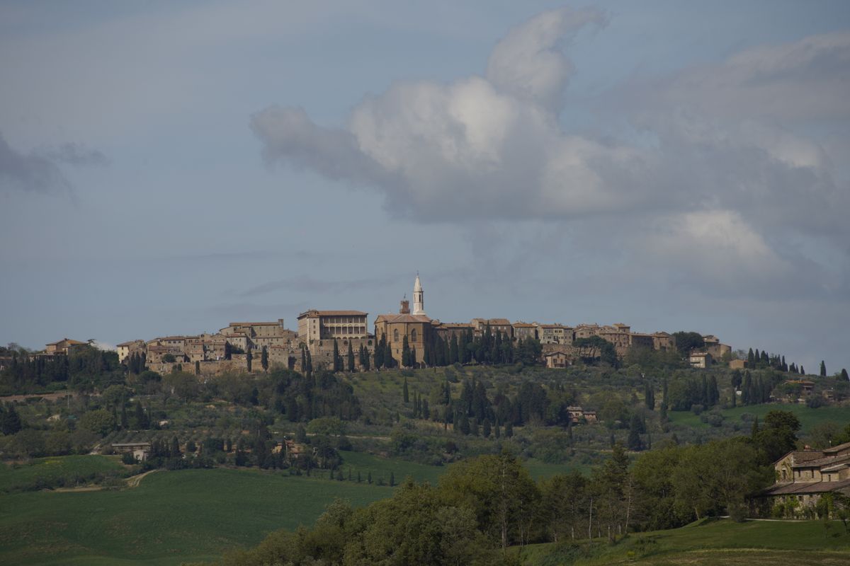 Panoramic view of Pienza, a hilltop Renaissance town perched on rolling Tuscan hills, Italy