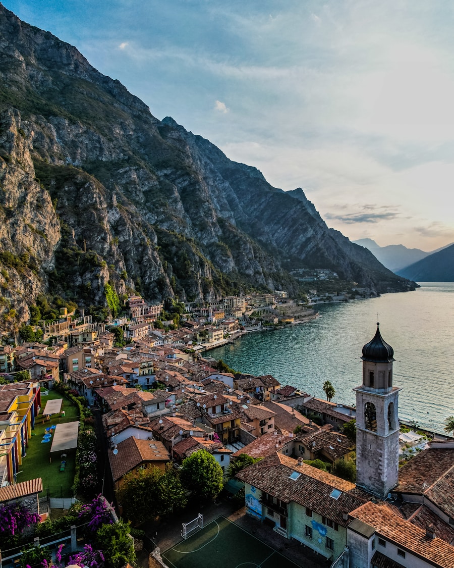 Aerial view of Limone sul Garda town beside the lake with dramatic mountain backdrop, Lake Garda, Italy