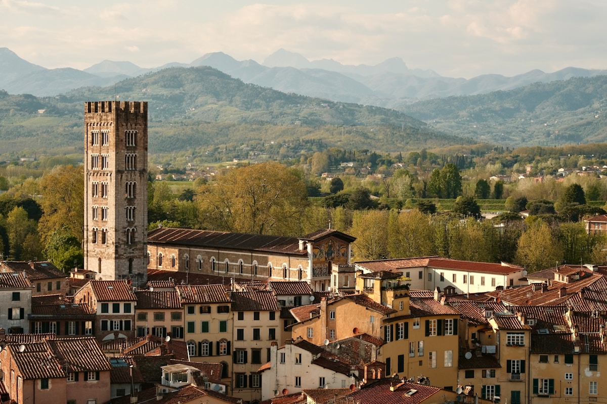 Tower and buildings overlooking the Italian landscape, Lucca, Tuscany, Italy