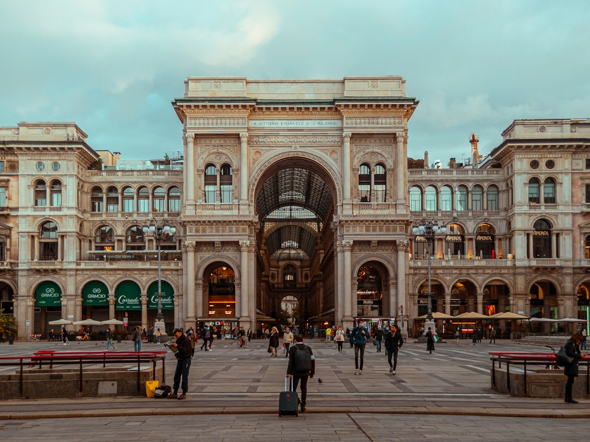People walking in front of Galleria Vittorio Emanuele II, Milan, Italy