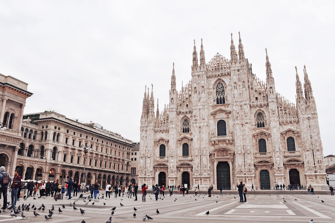 Milan Cathedral (Duomo di Milano) with pigeons in Piazza del Duomo, Italy