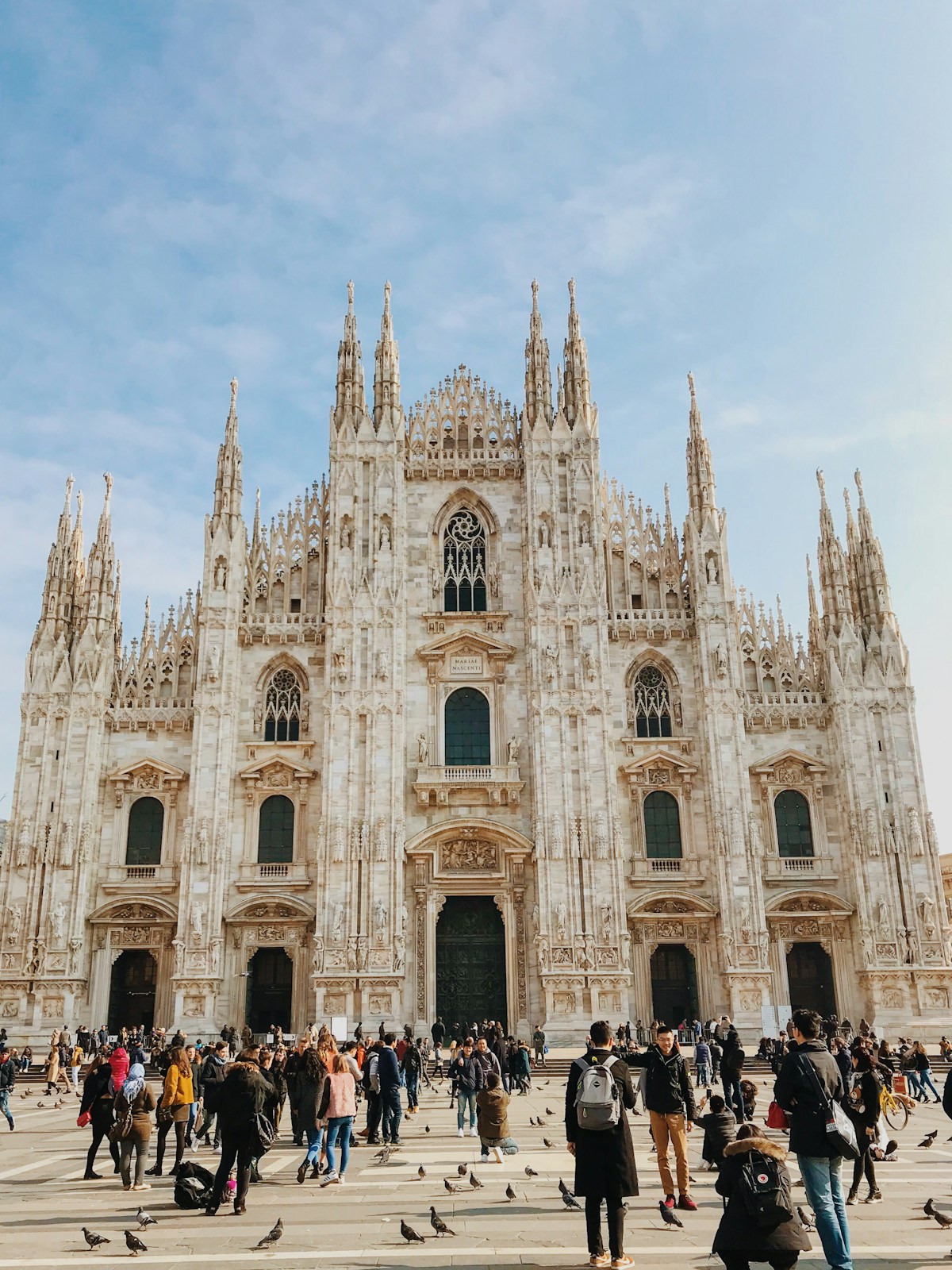 Milan Cathedral (Duomo di Milano) with crowds in Piazza del Duomo, Milan, Italy