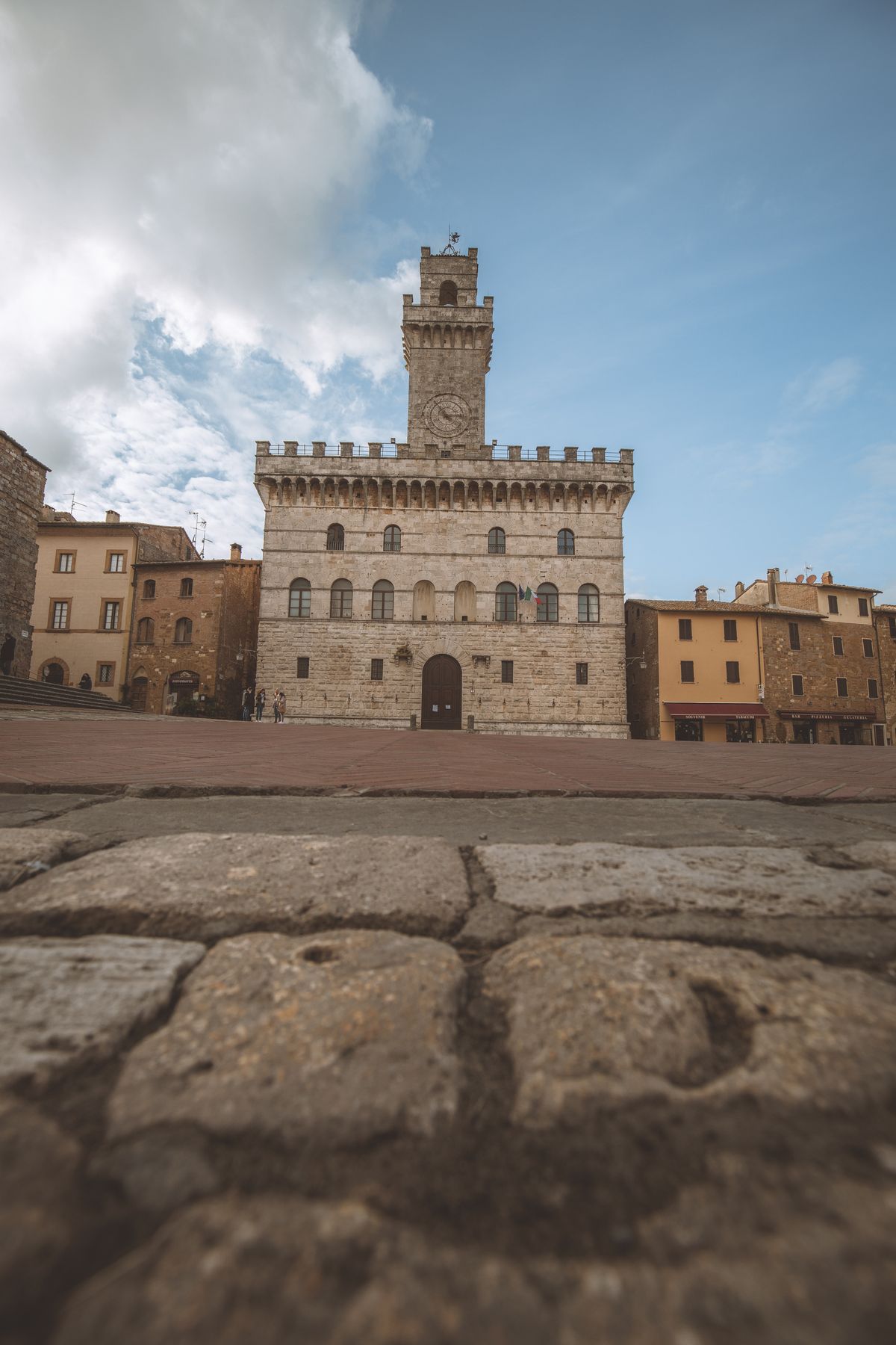 The Renaissance façade of the Duomo and Palazzo Contucci rising above Piazza Grande in Montepulciano, Tuscany
