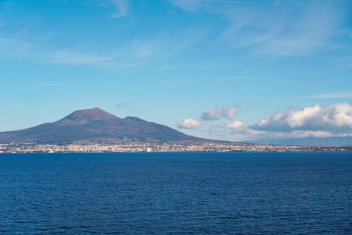 Mount Vesuvius overlooks the Bay of Naples from the water, Campania, Italy