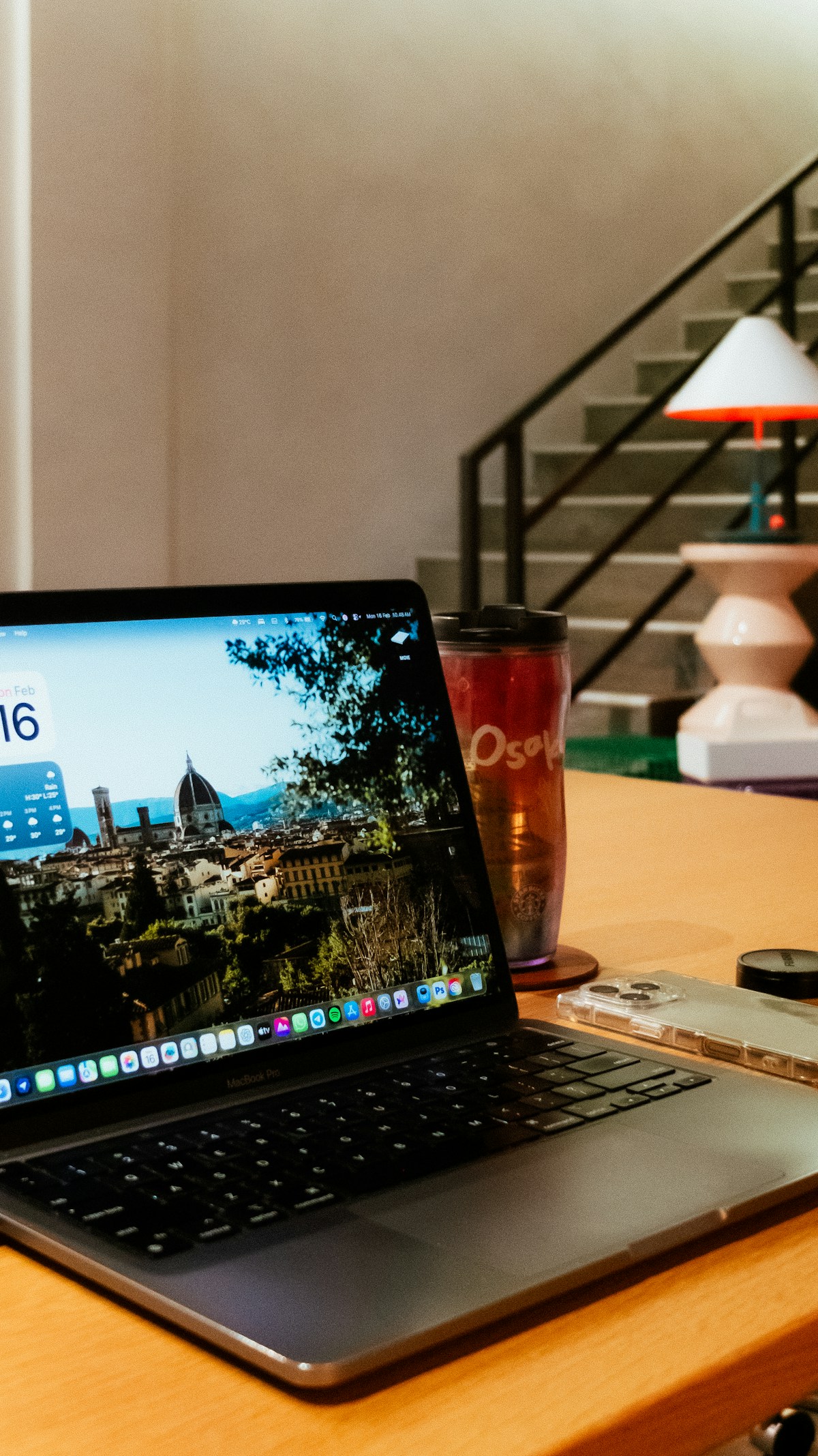 Laptop on desk, remote working and cost of living in Italy
