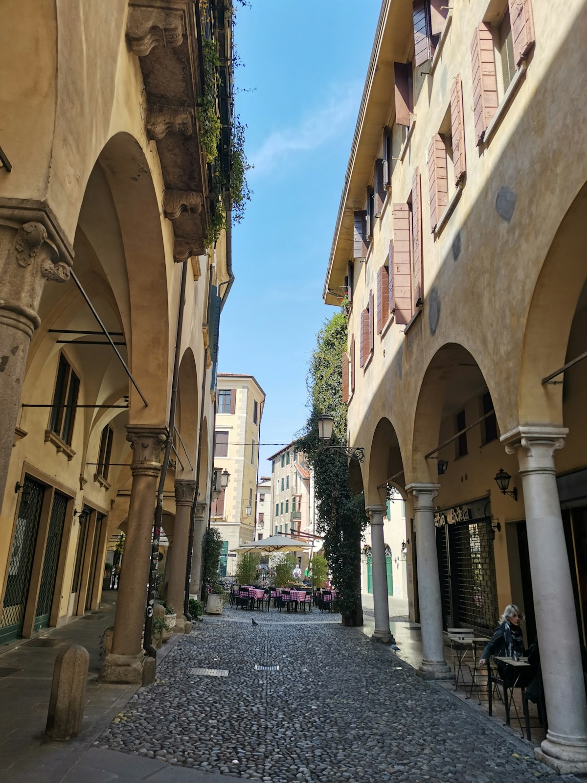 Cobblestone street between buildings in Padua, Veneto, Italy