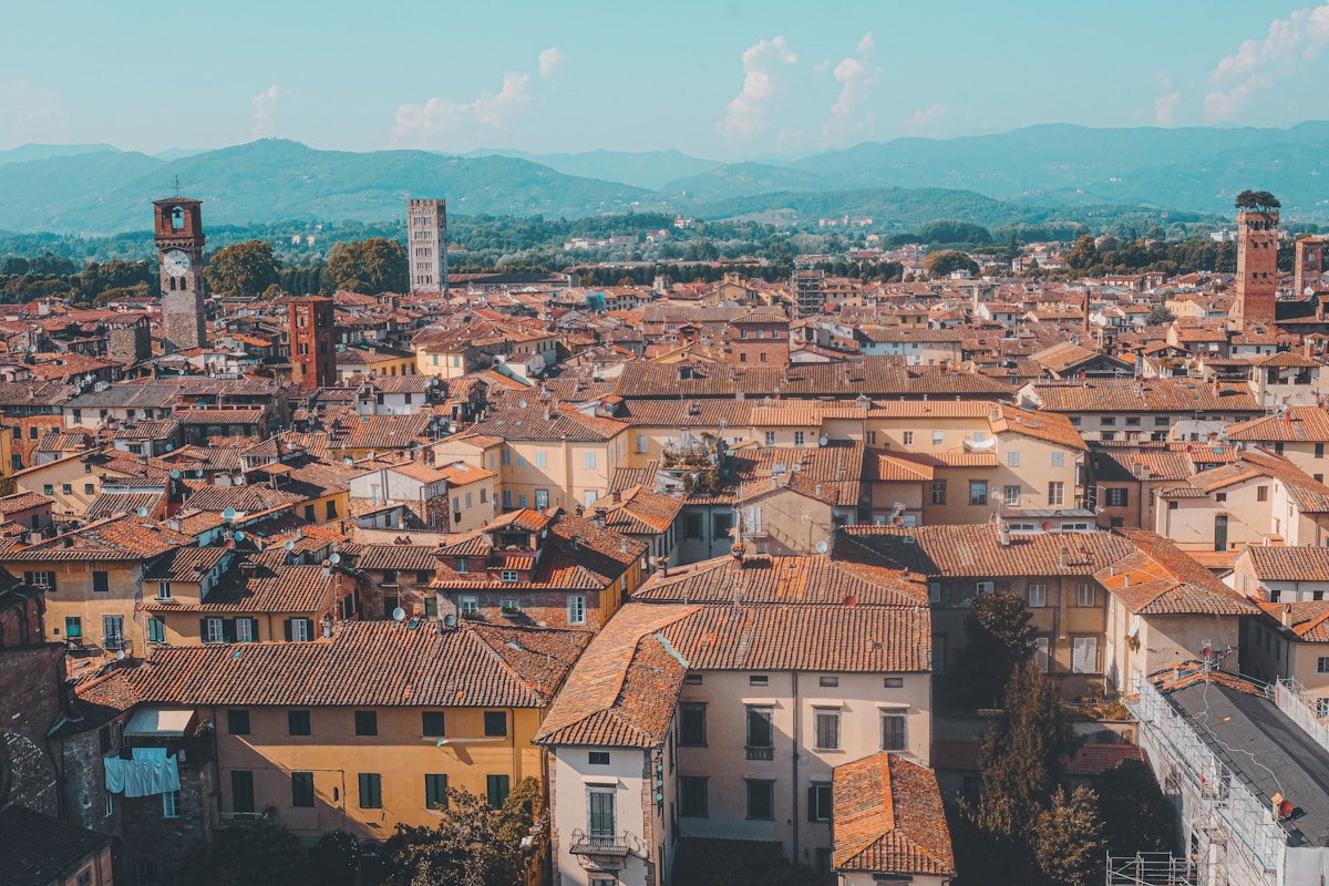 Aerial view of Lucca old town with historic walls, towers, and terracotta rooftops, Tuscany, Italy