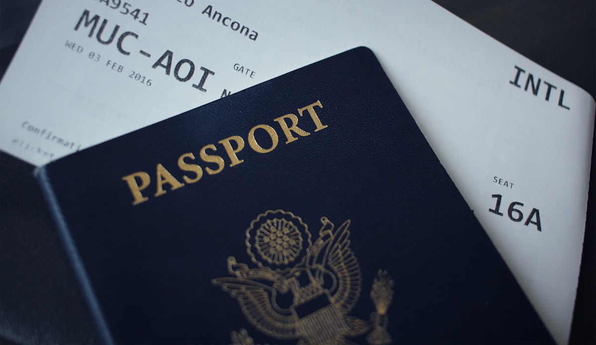 Passport and international boarding pass for travel to Italy