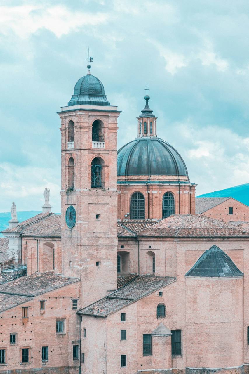 Urbino cathedral dome and bell tower viewed from the Albornoz Fortress, Le Marche, Italy