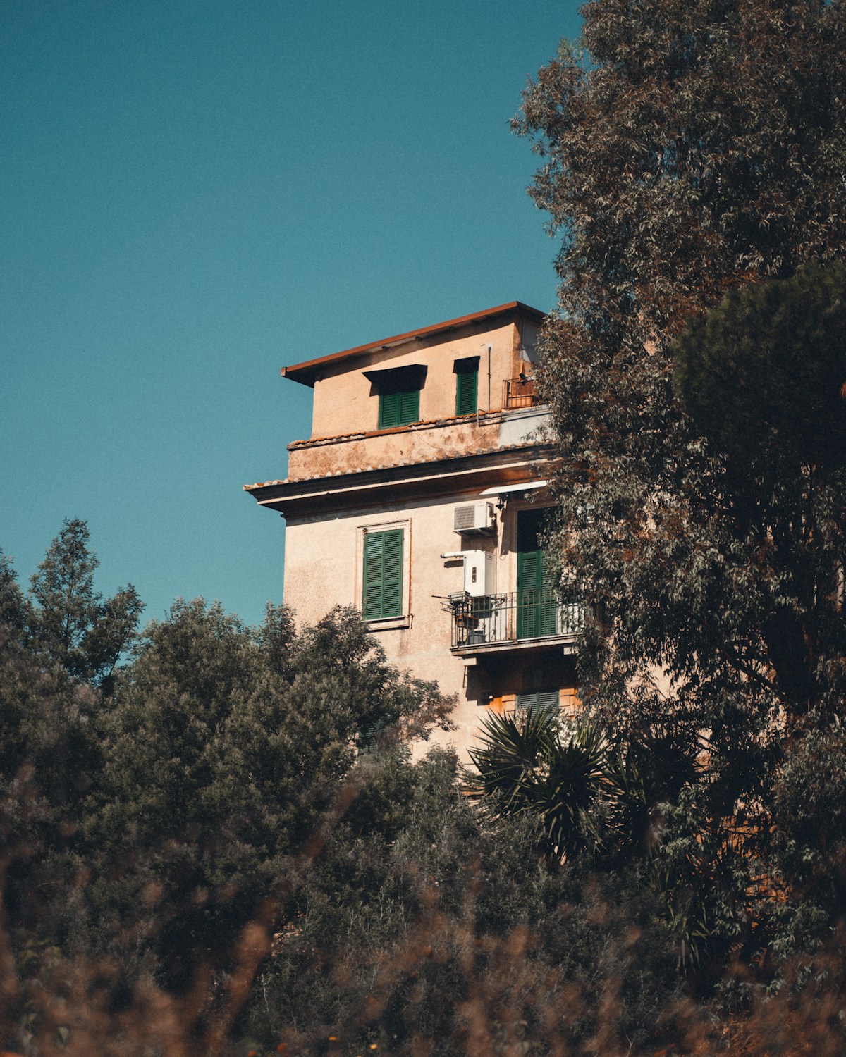 White concrete building near trees, Rome area day trips, Italy
