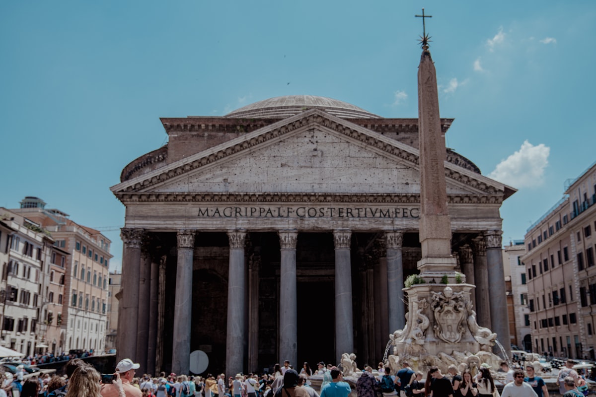The Pantheon exterior with its classical portico and people in Piazza della Rotonda, Rome, Italy