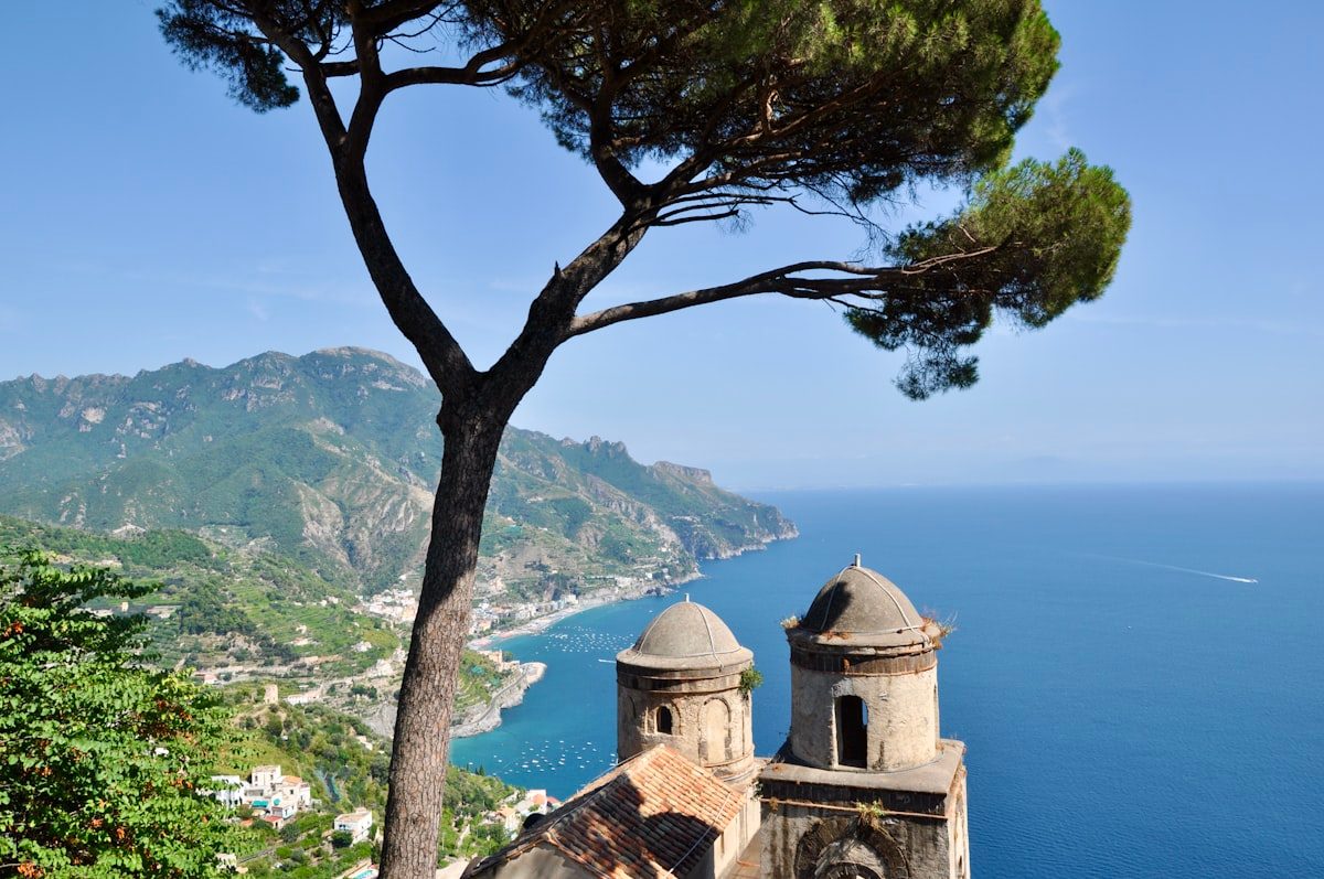 Sorrento's clifftop promenade and lemon grove terraces above the Bay of Naples with Vesuvius in the distance