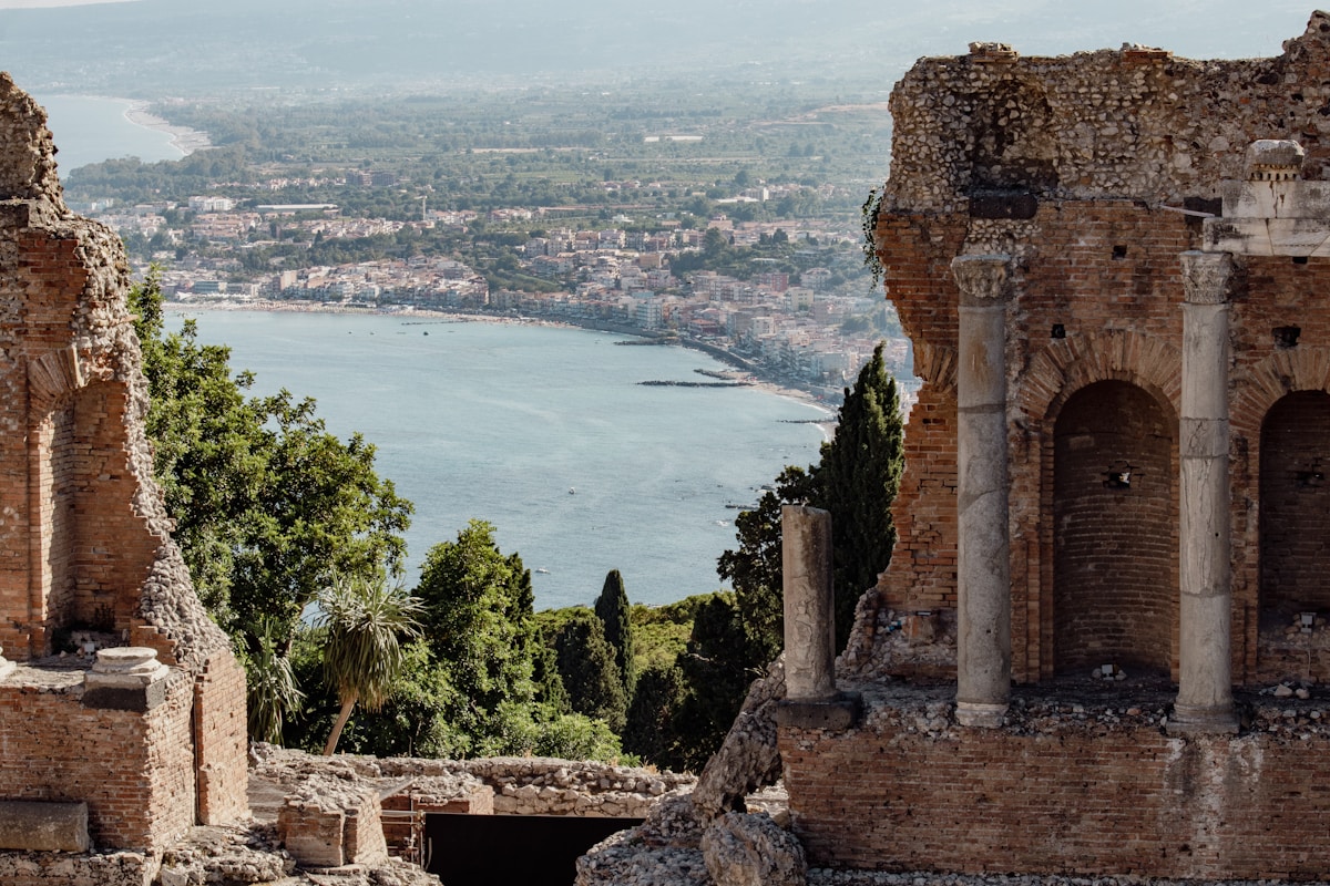 View of the Gulf of Naxos from the ruins of the ancient Greek Theatre, Taormina, Sicily, Italy