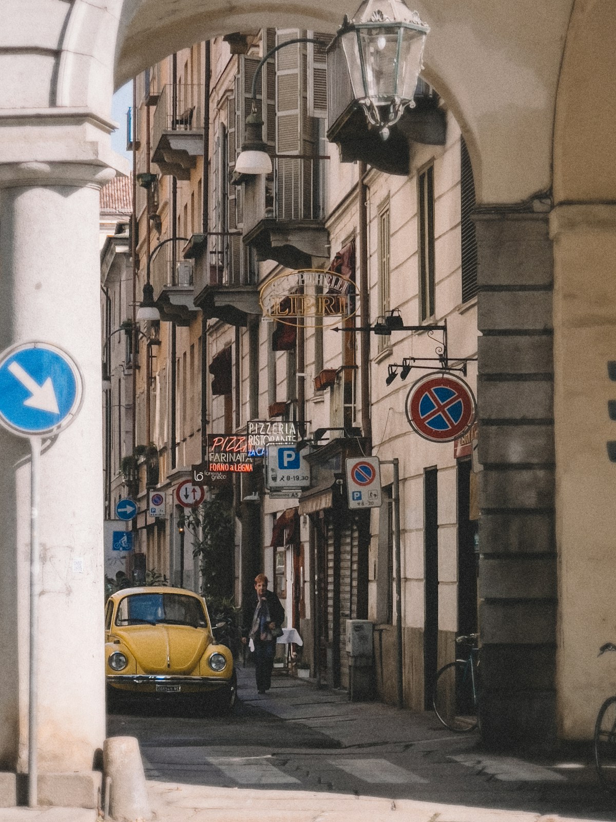Yellow car parked on street in Turin, Piedmont, Italy