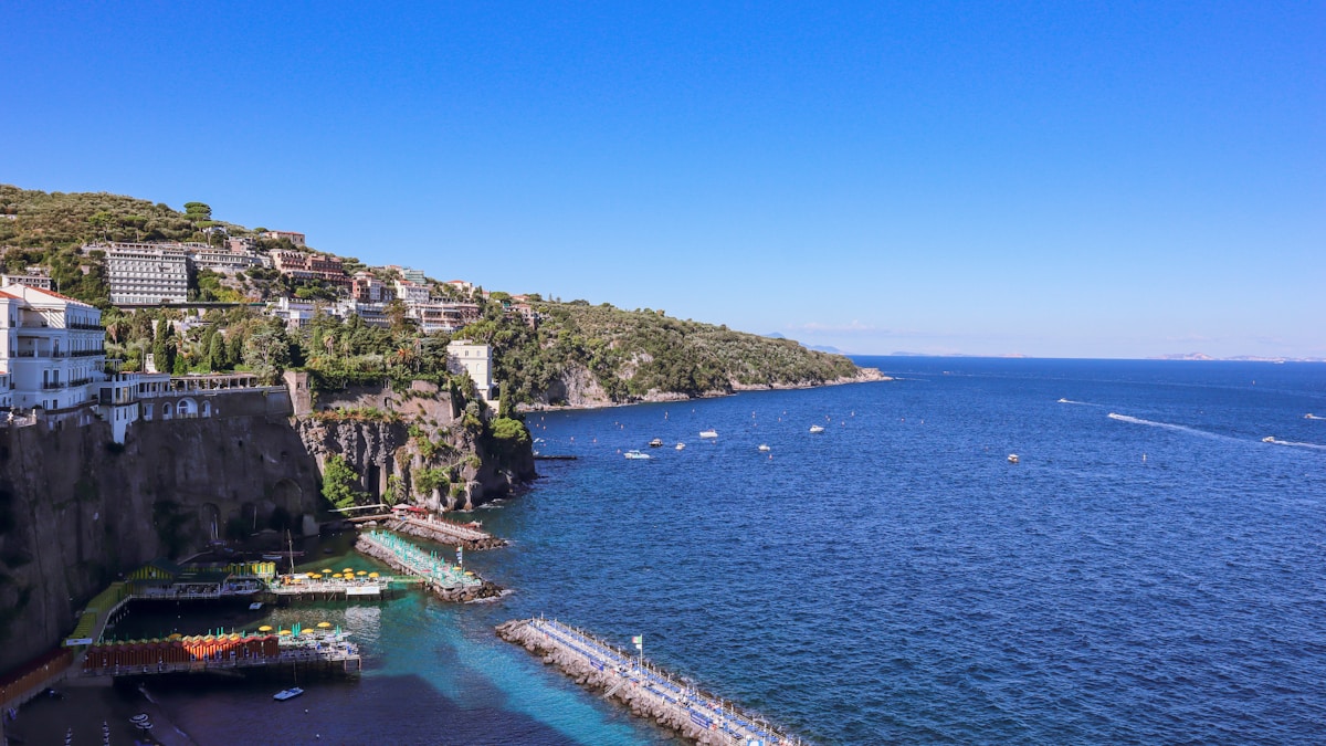 Sorrento's clifftop promenade and lemon grove terraces above the Bay of Naples with Vesuvius in the distance